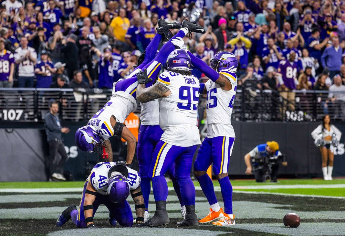 Minnesota Vikings cornerback Mekhi Blackmon (5) does inverted pushups on linebacker Ivan Pace J ...