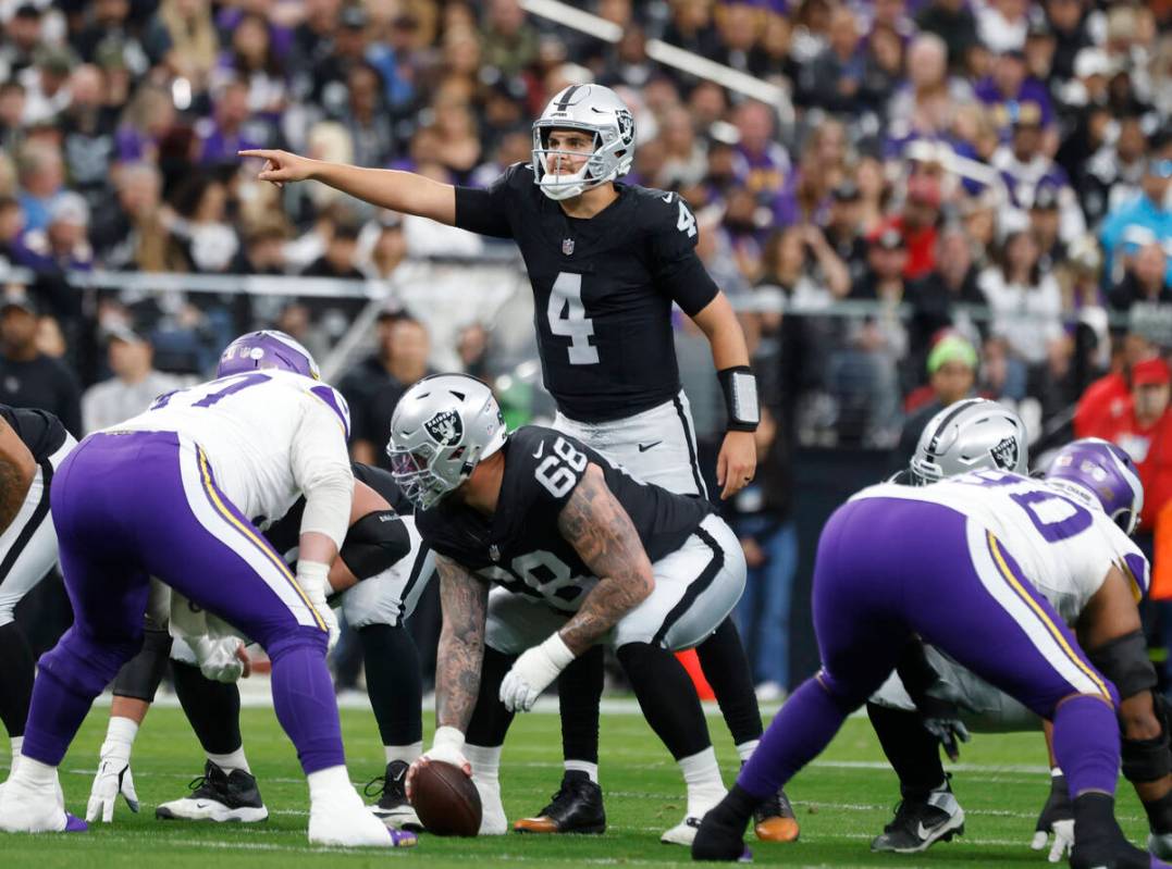 Raiders quarterback Aidan O'Connell (4) calls a play during the first half of an NFL football g ...