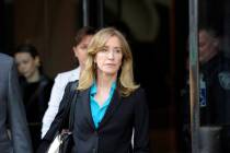 Actress Felicity Huffman exits the courthouse after facing charges for allegedly conspiring to ...