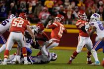 Kansas City Chiefs quarterback Patrick Mahomes (15) throws as he is hit during the second half ...