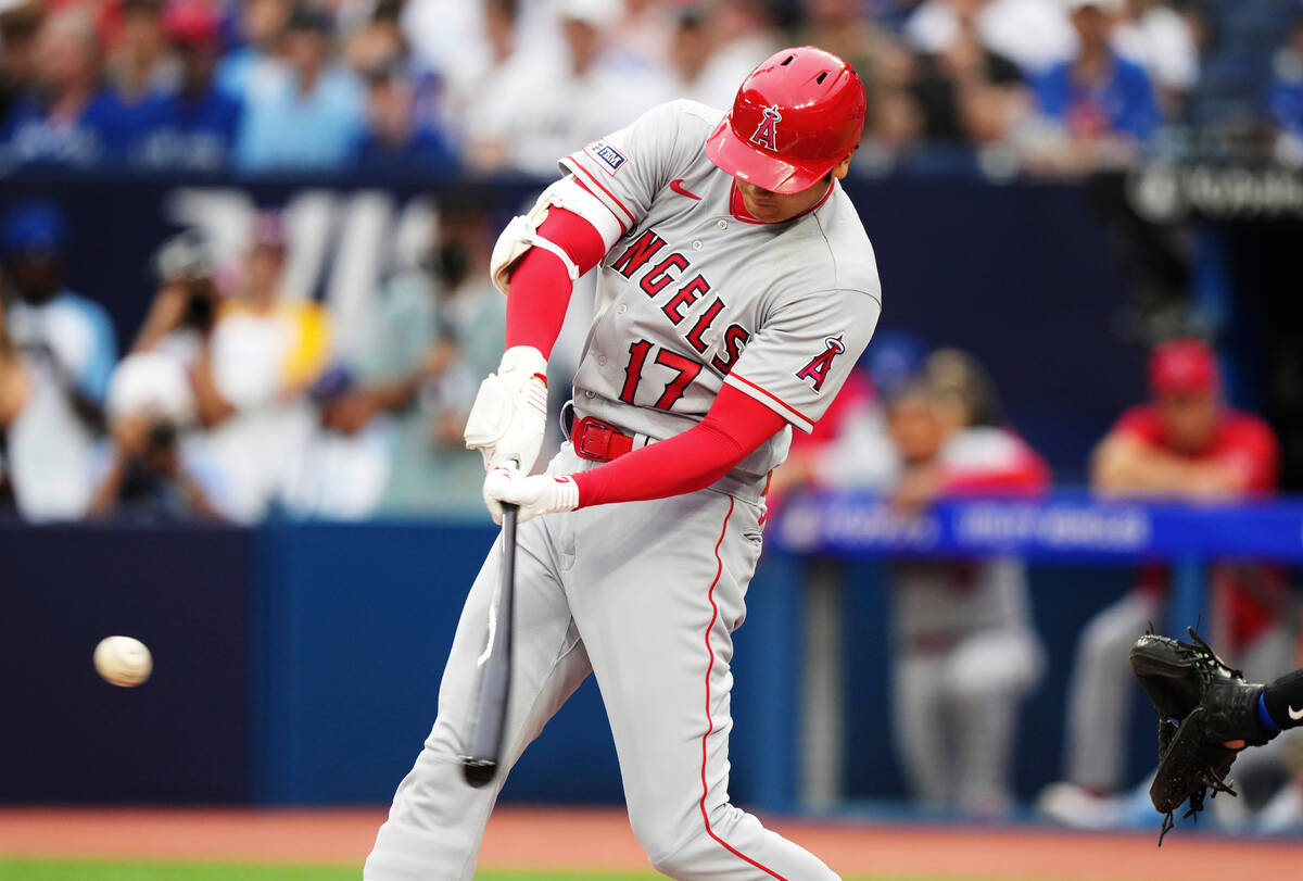 Los Angeles Angels designated hitter Shohei Ohtani hits a solo home run against the Toronto Blu ...