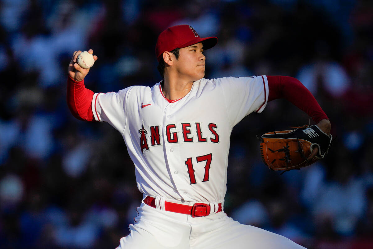 FILE - Los Angeles Angels starting pitcher Shohei Ohtani throws during a baseball game against ...