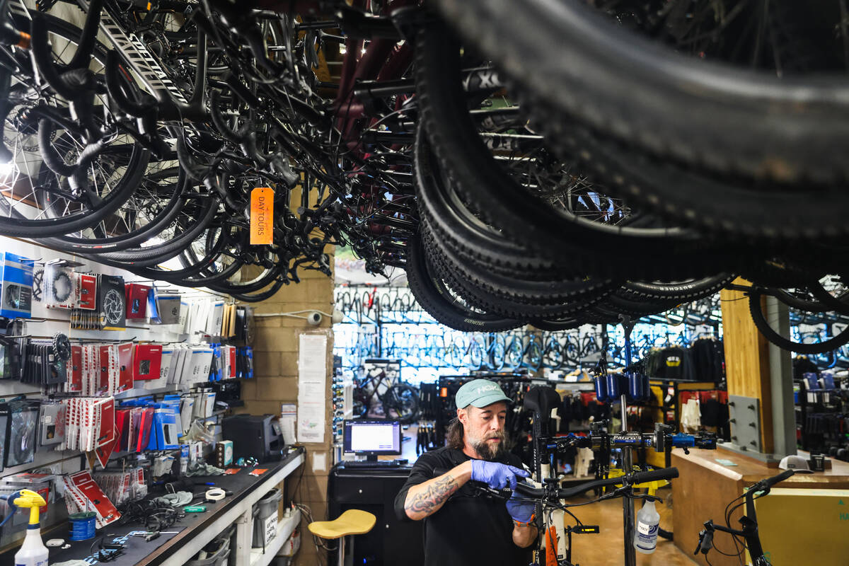 Chris Gorney, rental manager, prepares a bike for a tour at Las Vegas Cyclery in Las Vegas, Mon ...