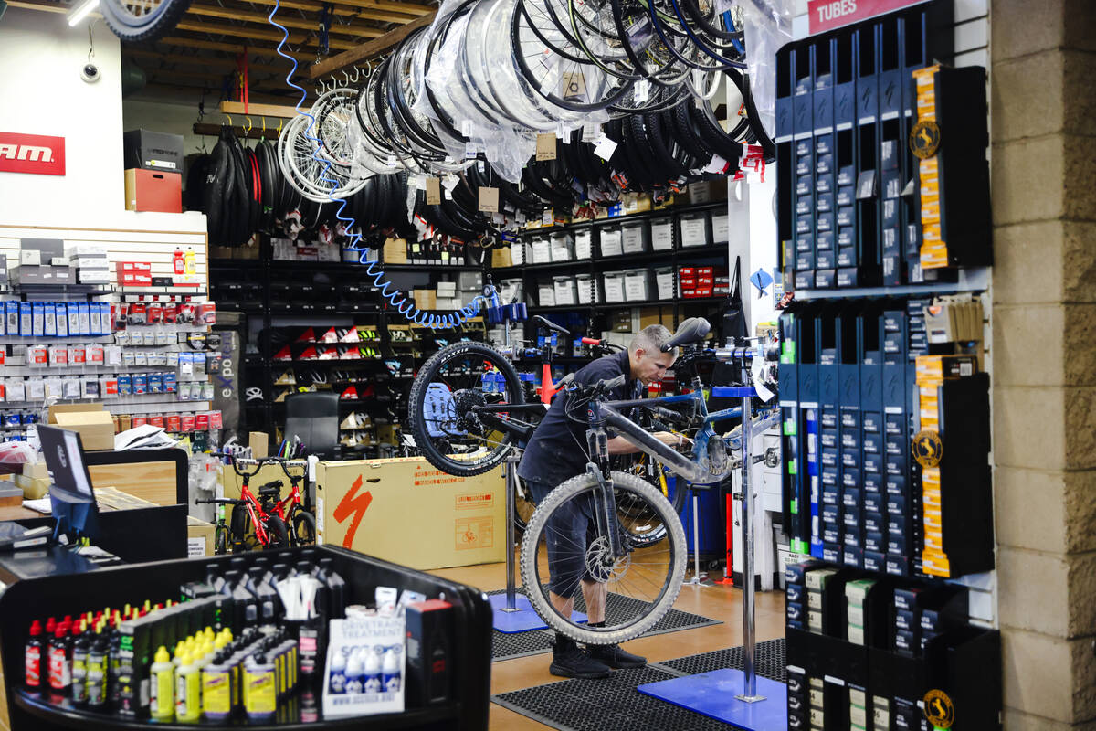 Jason Miller, assistant manager, fixes a bike at Las Vegas Cyclery in Las Vegas, Monday, Dec. 1 ...