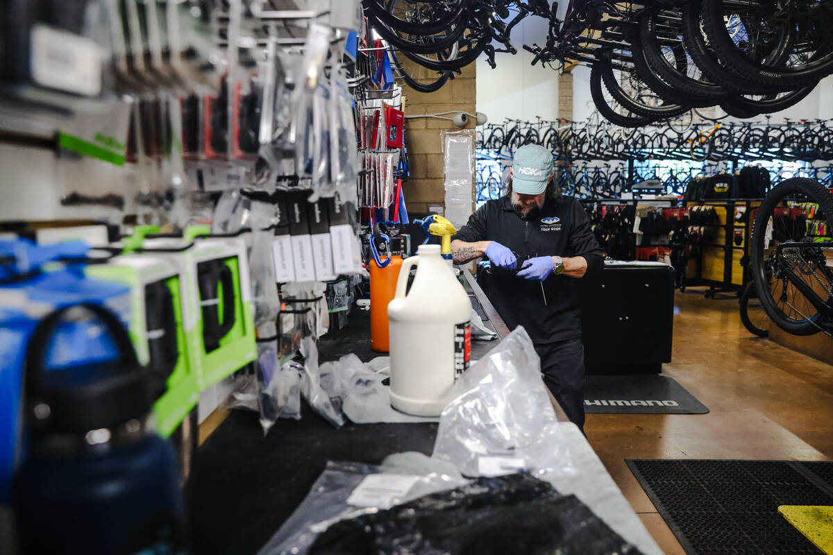 Chris Gorney, rental manager, prepares a bike for a tour at Las Vegas Cyclery in Las Vegas, Mon ...