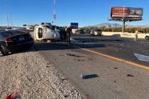 A vehicle is overturned near the scene of a crash that left three dead on U.S. Highway 95 near ...