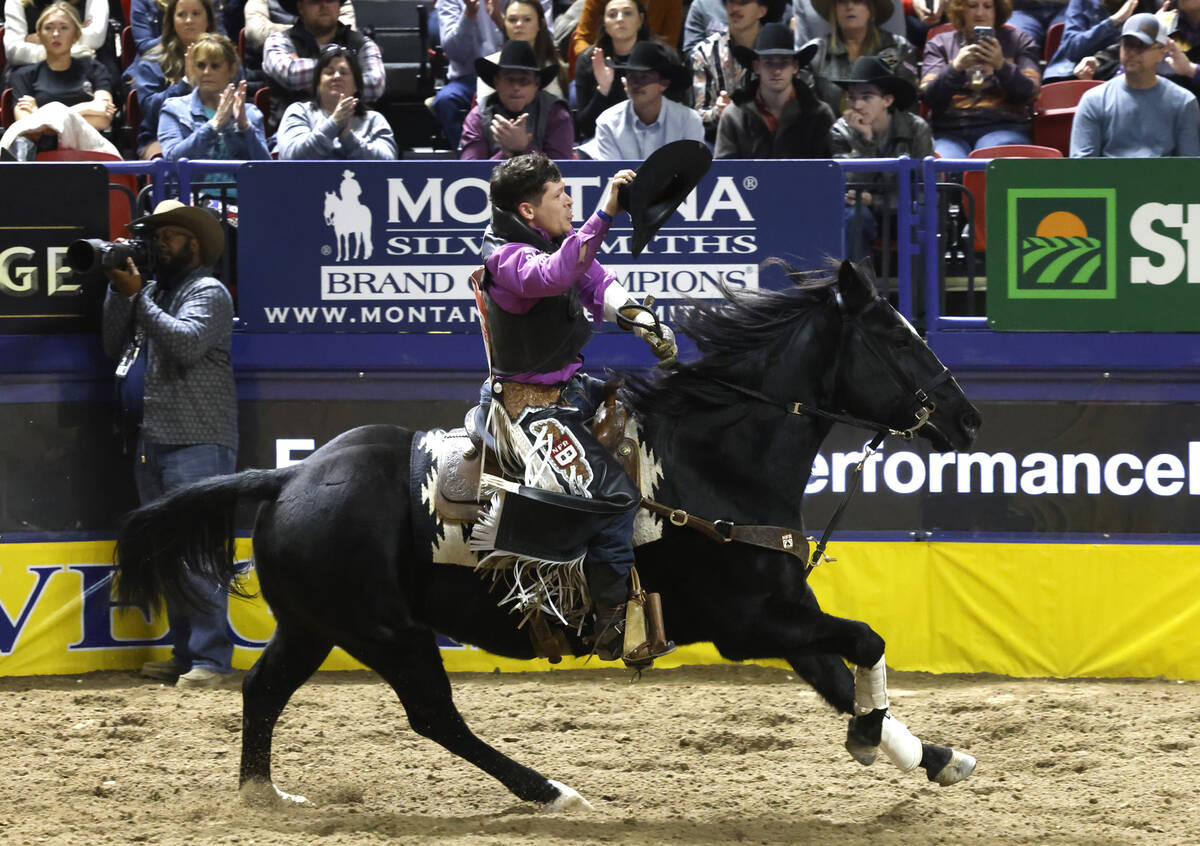 Tanner Aus reacts after sharing a first place win in bareback riding with Lacob Lees on day six ...