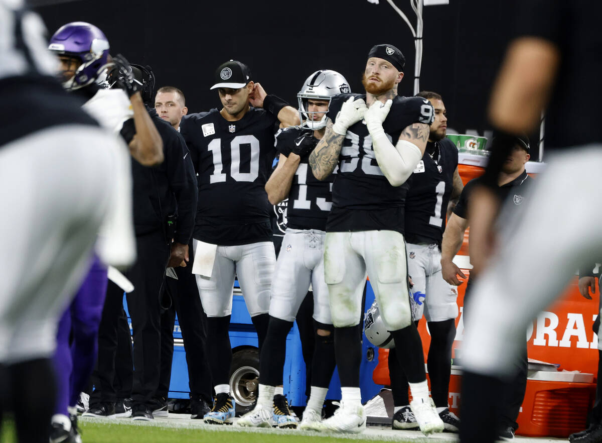 Raiders quarterback Jimmy Garoppolo (10), wide receiver Hunter Renfrow (13) and defensive end M ...