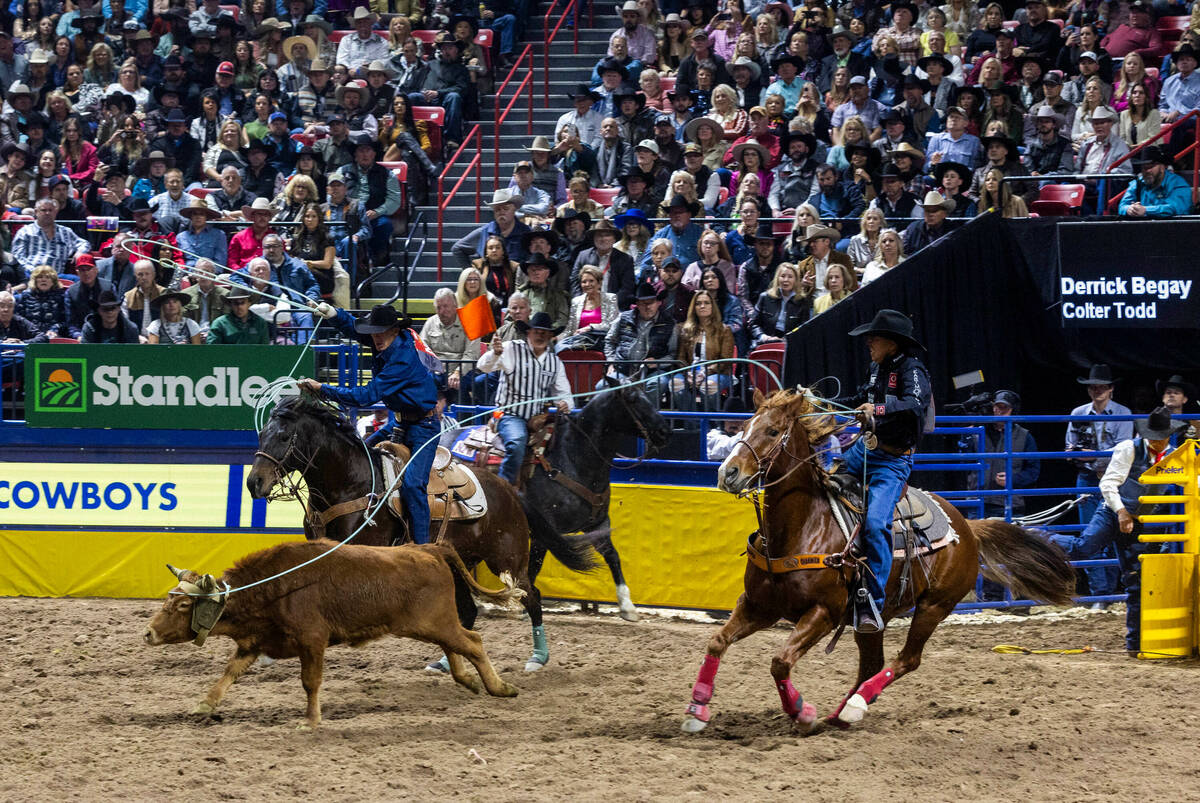 Header Derrick Begay and heeler Colter Todd work a calf in Team Roping during day 6 action of t ...