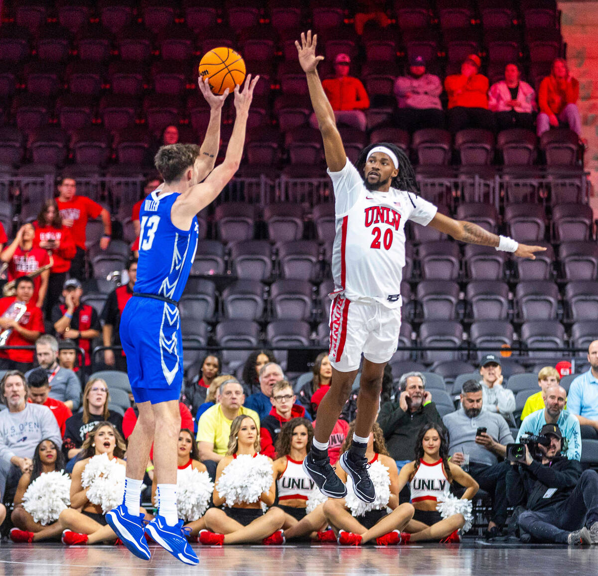 Creighton Bluejays forward Mason Miller (13) looks to shoot over UNLV Rebels forward Keylan Boo ...