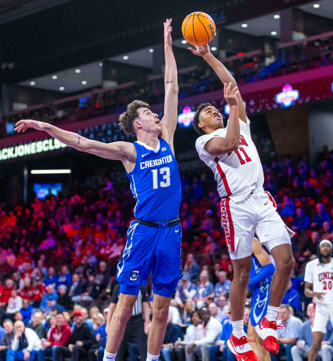 Creighton Bluejays forward Mason Miller (13) is unable to stop a shot by UNLV Rebels guard Deda ...