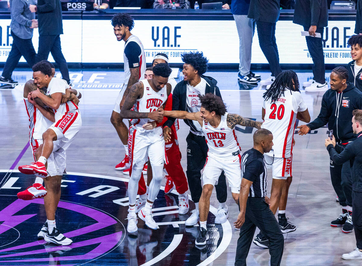 The UNLV Rebels celebrate their win over the Creighton Bluejays 79-64 ending the second half of ...