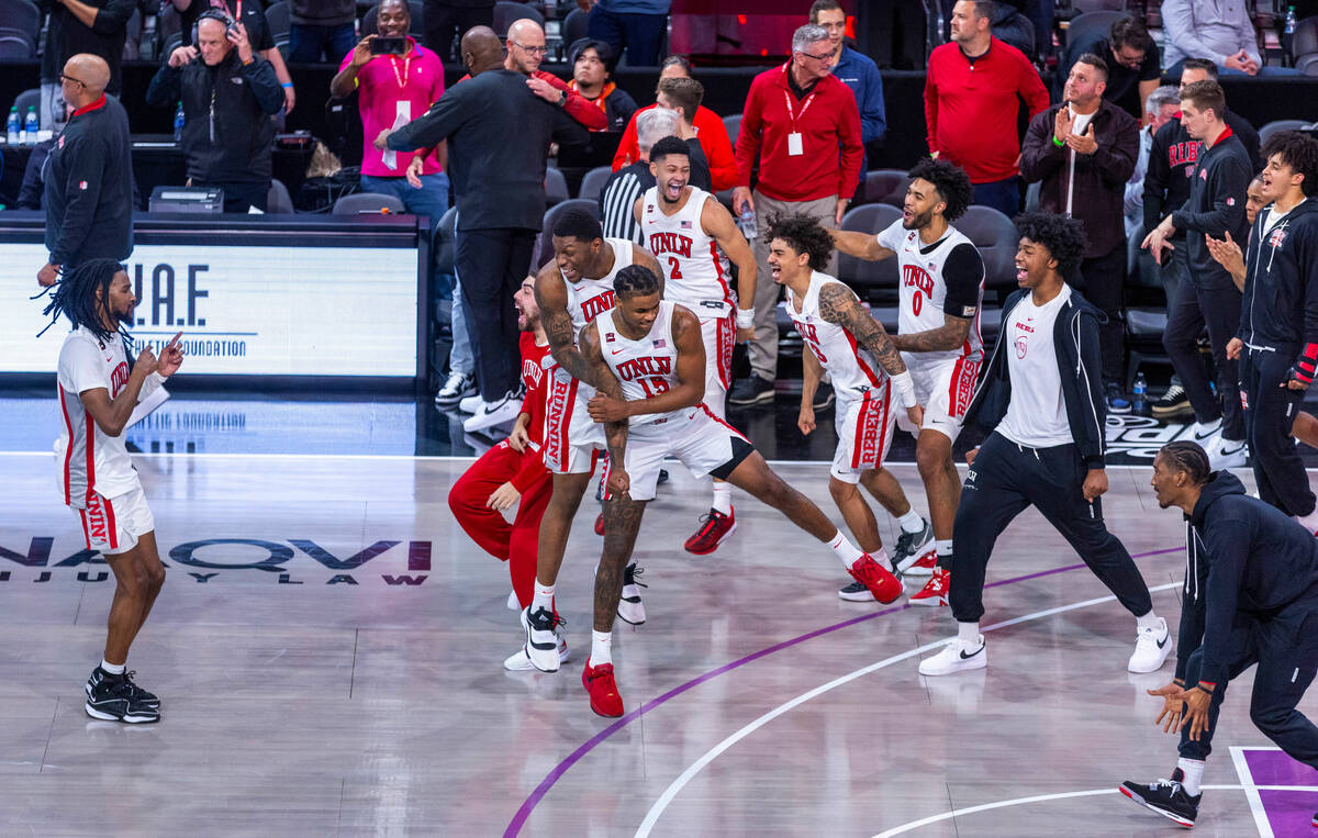 The UNLV Rebels celebrate their win over the Creighton Bluejays 79-64 ending the second half of ...