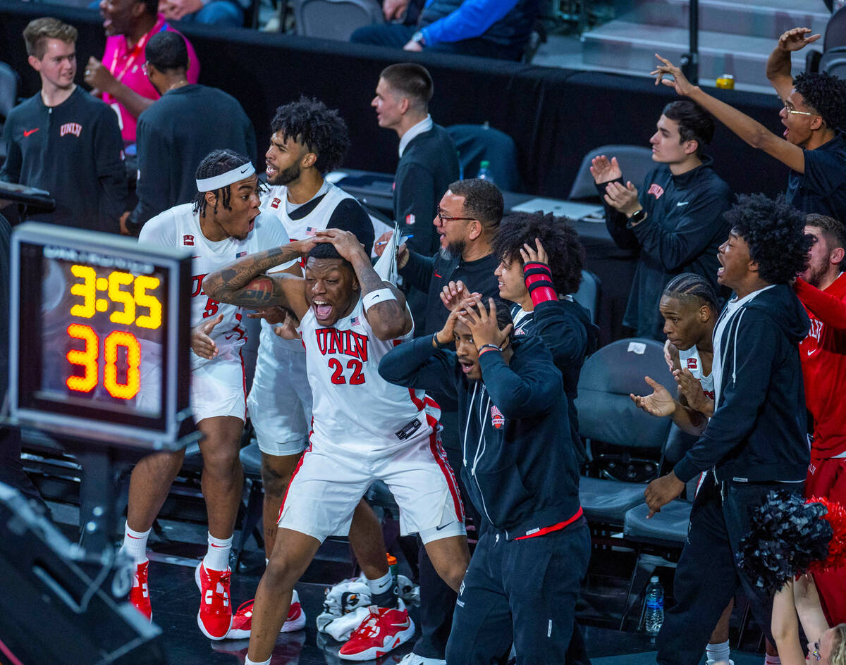 The UNLV Rebels bench are amazed by a huge dunk against the Creighton Bluejays during the secon ...