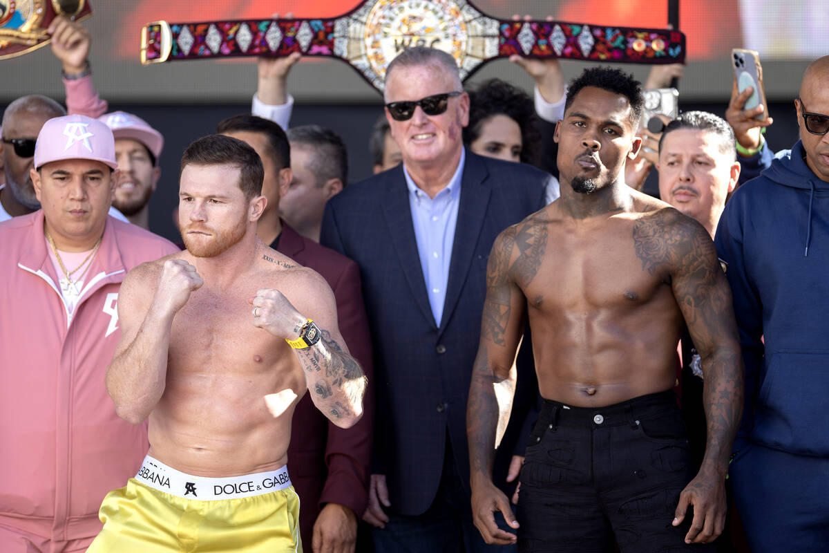 Canelo Alvarez, left, poses with Jermell Charlo after their weigh in at Toshiba Plaza on Friday ...