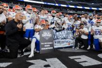 Bishop Gorman poses for photos after winning the Class 5A Division I high school football state ...