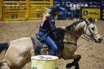 Sue Smith rounds the barrel during day three of the National Finals Rodeo at the Thomas & M ...