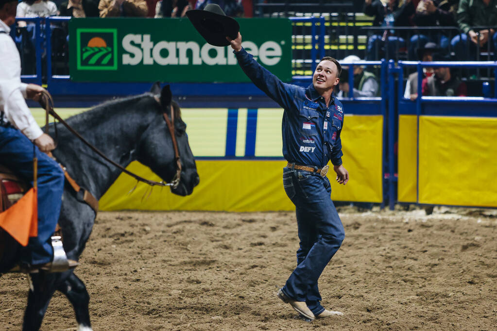Bridger Anderson gestures to the crowd during the National Finals Rodeo at the Thomas & Mac ...