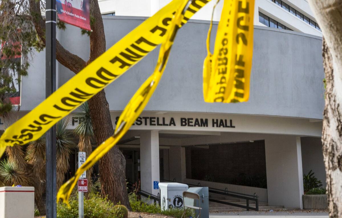 Police tape remains on a tree outside the entrance to the Frank and Estella Beam Hall following ...