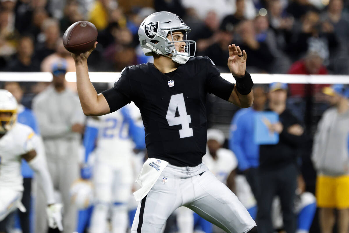 Raiders quarterback Aidan O'Connell (4) throws a pass against Los Angeles Chargers during the f ...