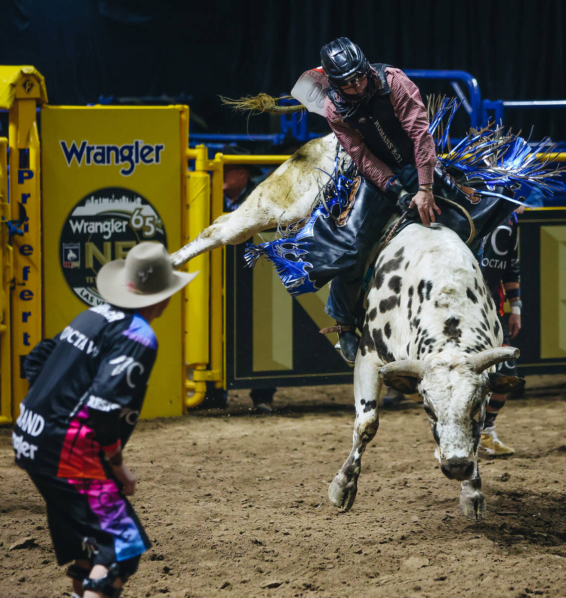 Hayes Weight stays on top of the bull during the National Finals Rodeo at the Thomas & Mack ...