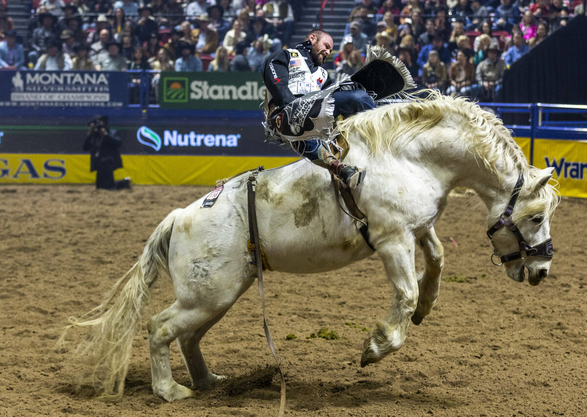 Mason Clements rides Virgil in Bareback Riding during the final day action of the NFR at the Th ...