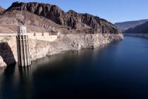 Lake Mead and the “bathtub ring” are shown with a Nevada intake tower at Hoover Dam outside ...