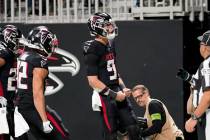 Atlanta Falcons quarterback Desmond Ridder (9) reacts after running for touchdown against the T ...
