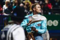 Tuf Cooper gestures towards the crowd during the tie down roping event at the National Finals R ...