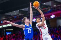 Creighton Bluejays forward Mason Miller (13) is unable to stop a shot by UNLV Rebels guard Deda ...