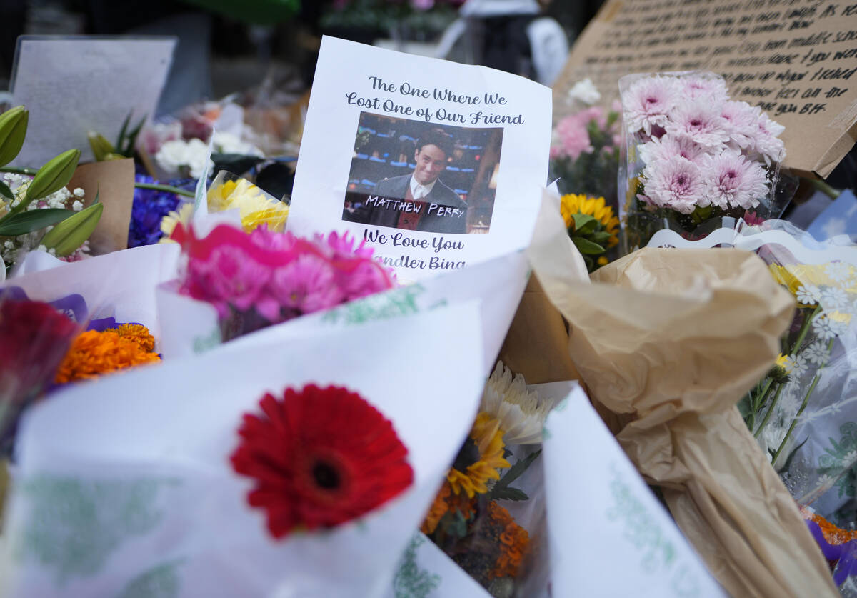 A makeshift memorial for Matthew Perry is seen outside the building shown in exterior shots of ...