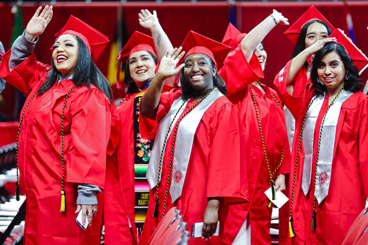 UNLV graduates wave to family and friends at the winter commencement ceremony at the Thomas &am ...