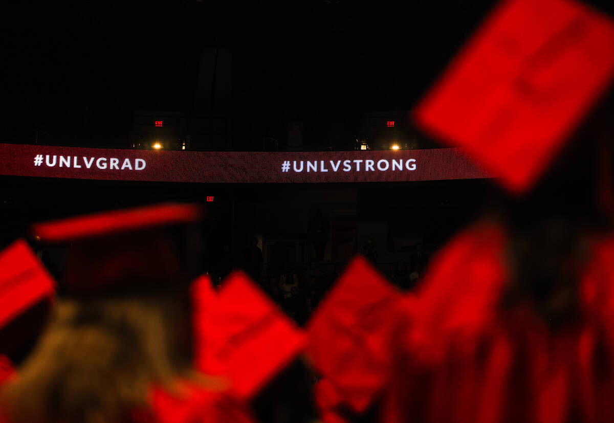 #UNLVSTRONG flashes on the screens at the winter commencement ceremony at the Thomas & Mack ...
