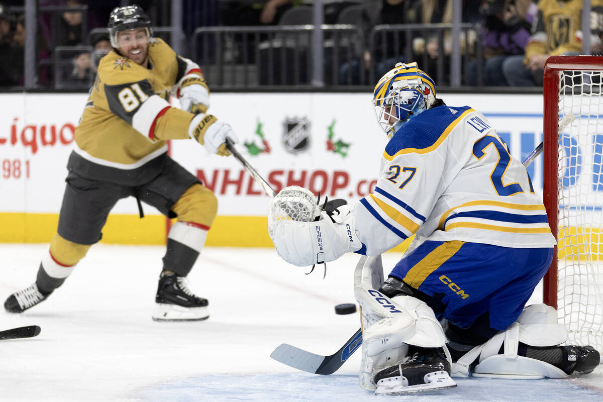Sabres goaltender Devon Levi (27) saves the puck after Golden Knights right wing Jonathan March ...