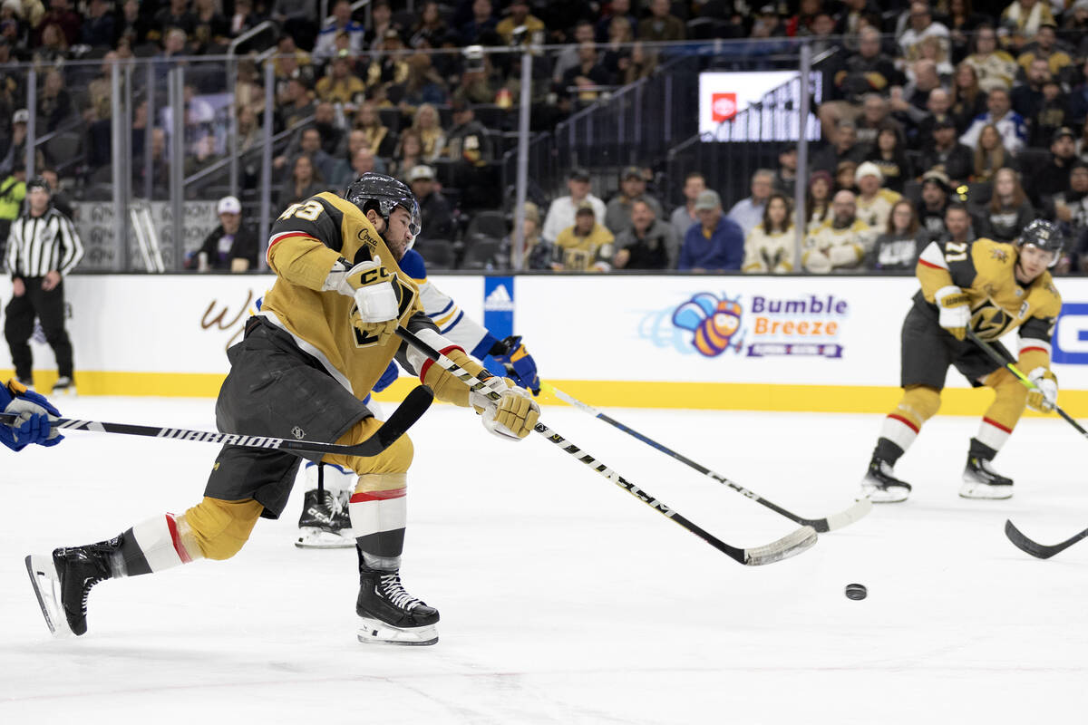 Golden Knights center Paul Cotter (43) takes a shot on goal during the first period of an NHL h ...