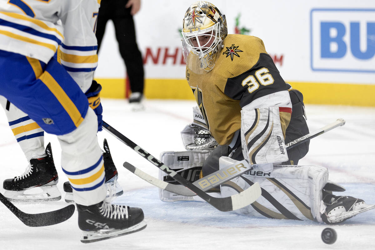 Golden Knights goaltender Logan Thompson (36) saves the puck against the Sabres during the seco ...