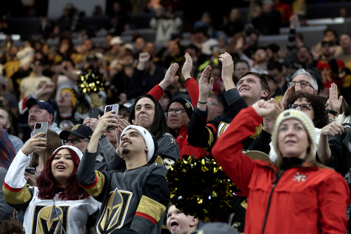 Golden Knights fans celebrate after their team scored during the second period of an NHL hockey ...