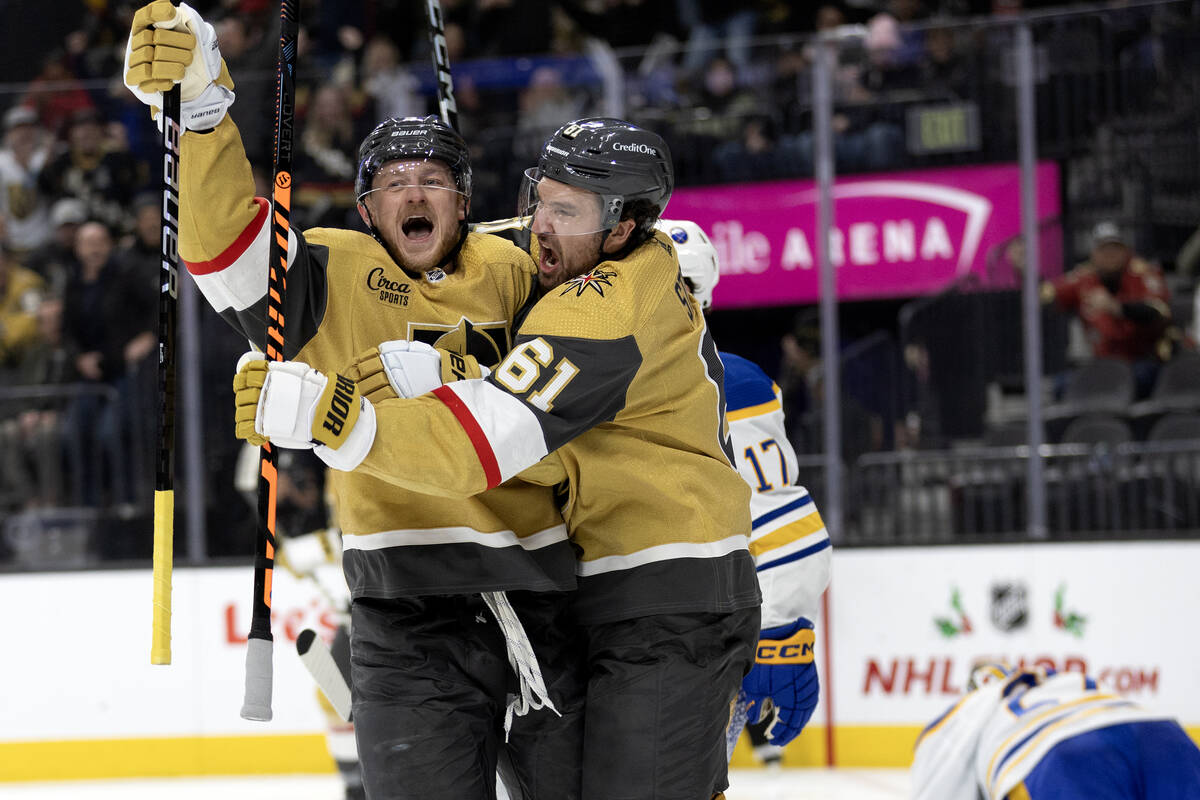 Golden Knights center Jack Eichel (9) and right wing Mark Stone (61) celebrate Eichel’s ...