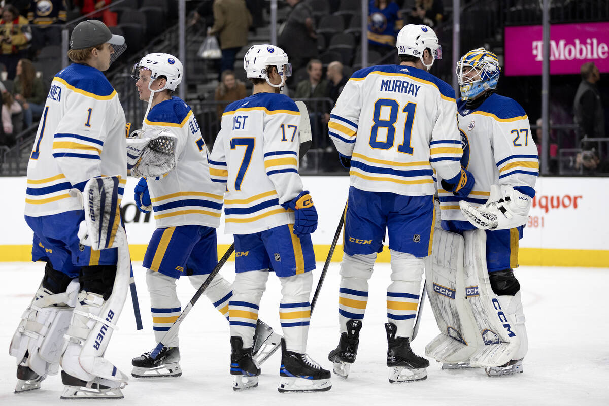 The Sabres congratulate goaltender Devon Levi (27) on their win in an NHL hockey game against t ...