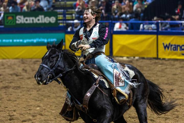 Keenan Hayes celebrates his PRCA World Championship in Bareback Riding during the final day act ...