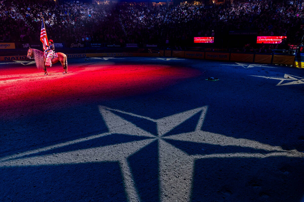 The American flag is presented as the National Anthem is played during the final day action of ...