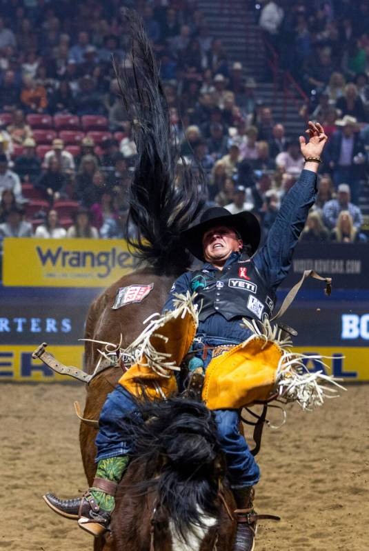 Richmond Champion rides Yipee Kibitz in Bareback Riding during the final day action of the NFR ...