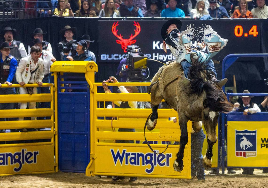 Keenan Hayes rides Straight Ringer in Bareback Riding during the final day action of the NFR at ...