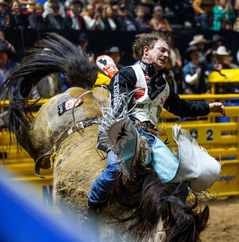 Keenan Hayes rides Straight Ringer in Bareback Riding during the final day action of the NFR at ...