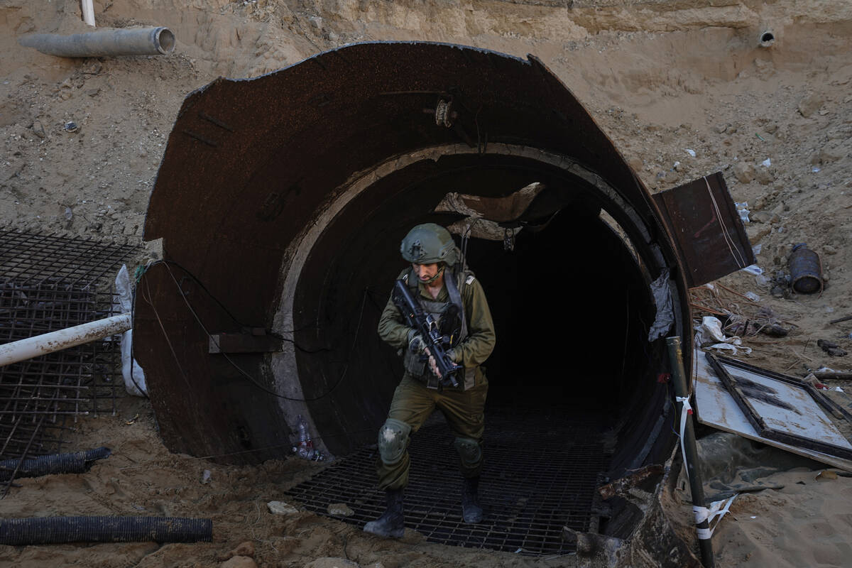Israeli soldiers exit a tunnel that the military says Hamas militants used to attack the Erez c ...
