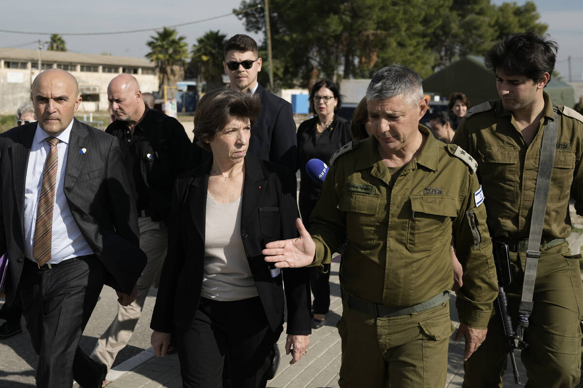 French Foreign Minister Catherine Colonna, center left, talks with Israeli Col. Olivier Rafowic ...