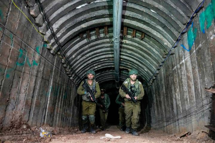 Israeli soldiers are seen in a tunnel that the military says Hamas militants used to attack the ...