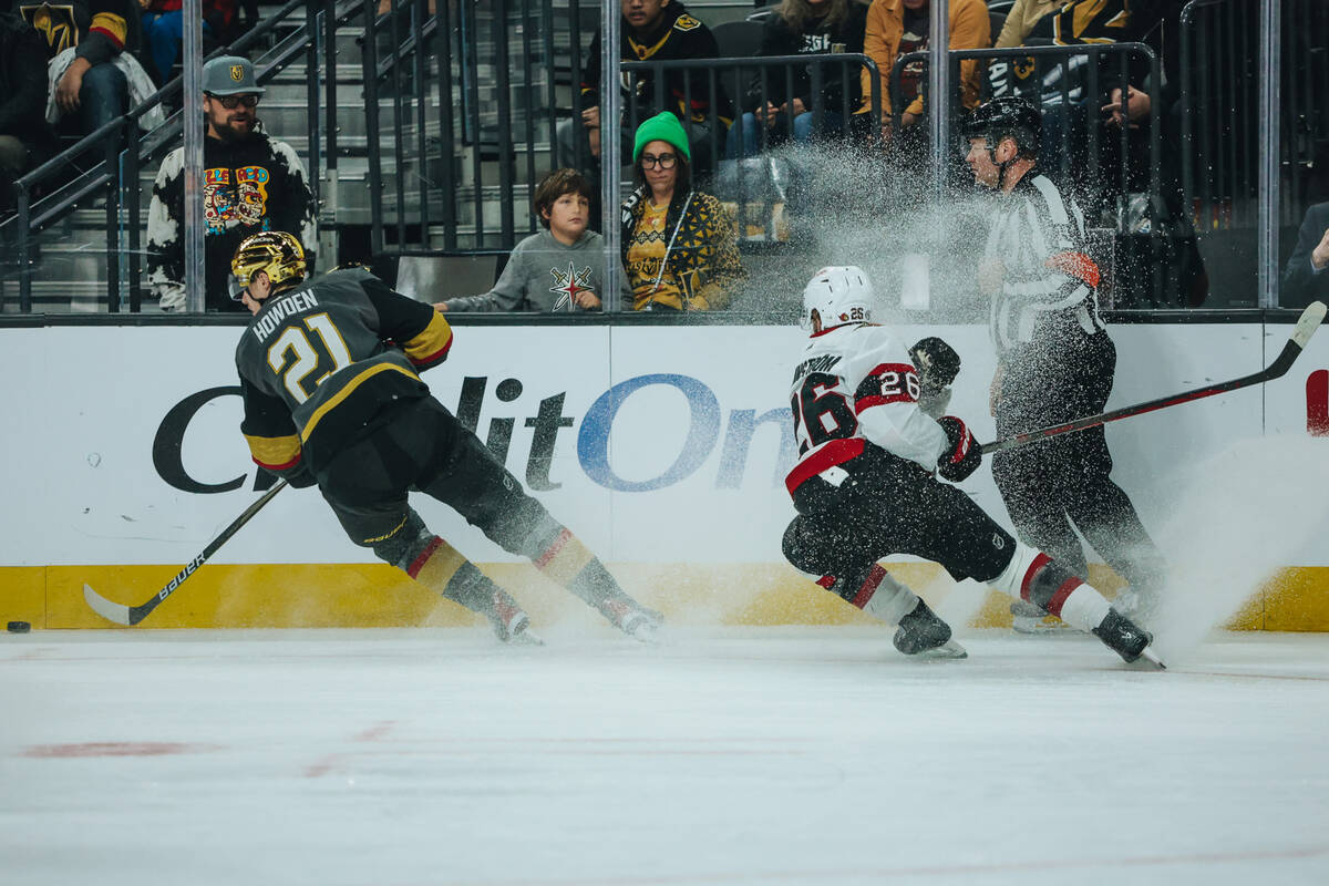 Golden Knights center Brett Howden (21) chases the puck as Ottawa Senators defenseman Erik Bran ...