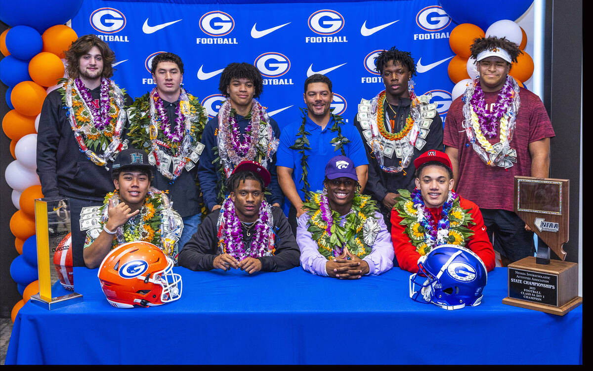 Bishop Gorman football players with head coach Brent Browner after signing their commitment let ...