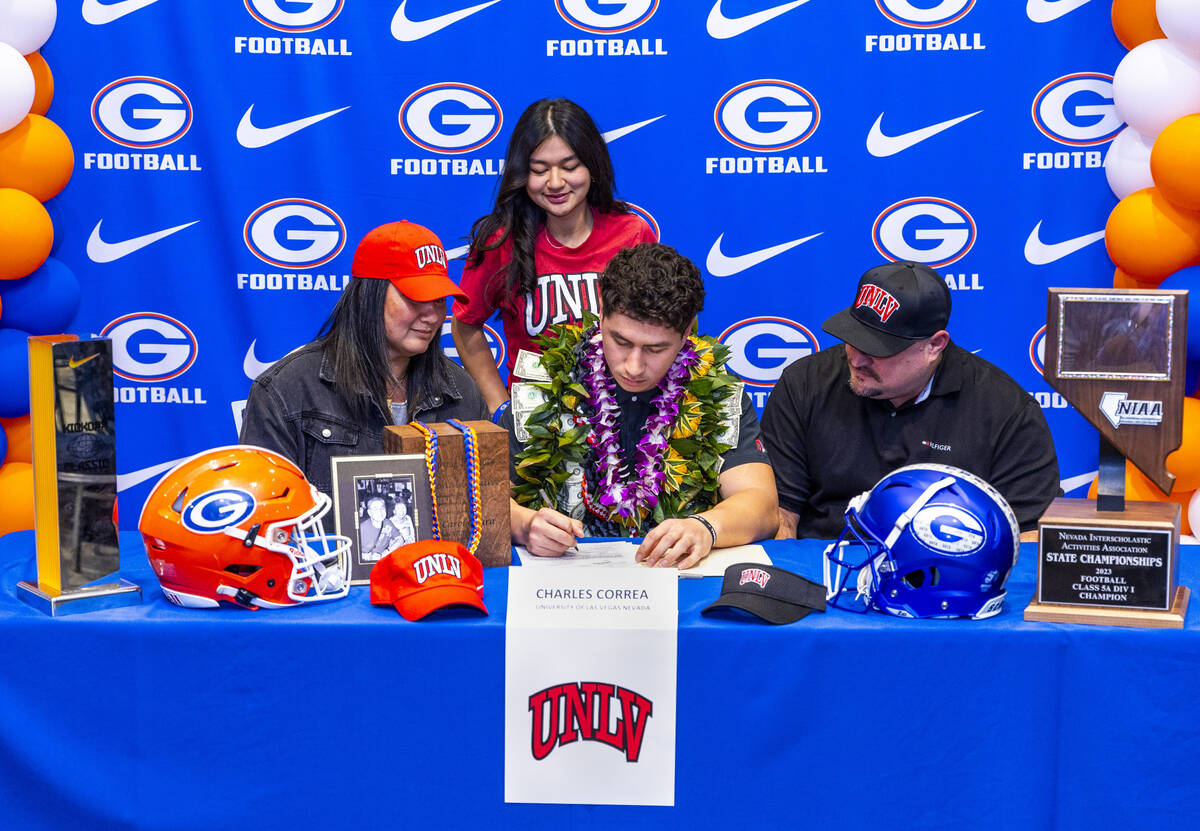 Bishop Gorman player Charles Correa and family with a commitment letter to UNLV during a Nation ...